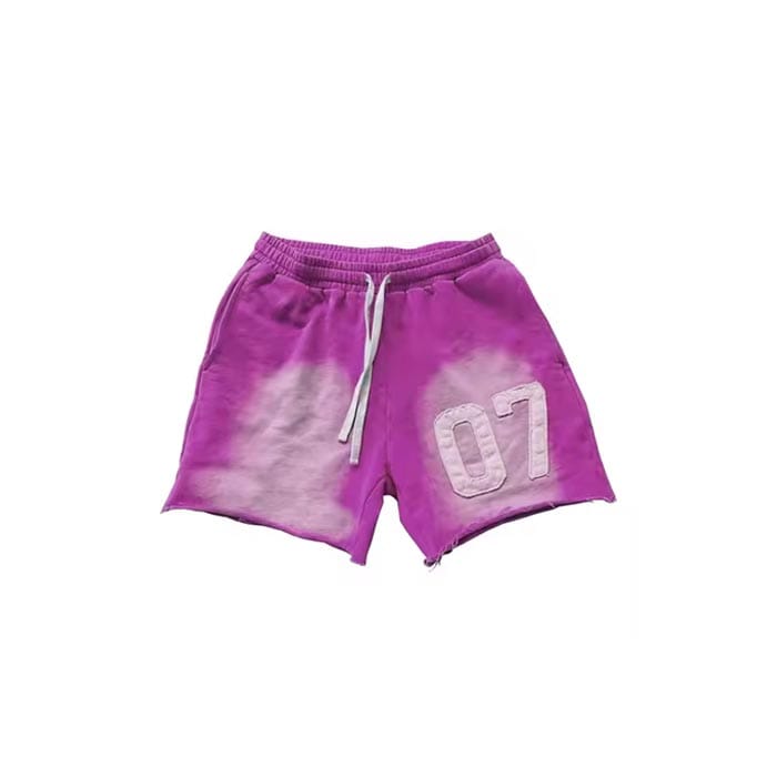 Custom sunfaded shorts with embroidered patch, drawstring waist, and vintage-wash finish