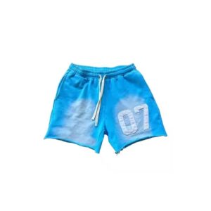 Custom sunfaded patchwork shorts with contrast details and distressed raw hems