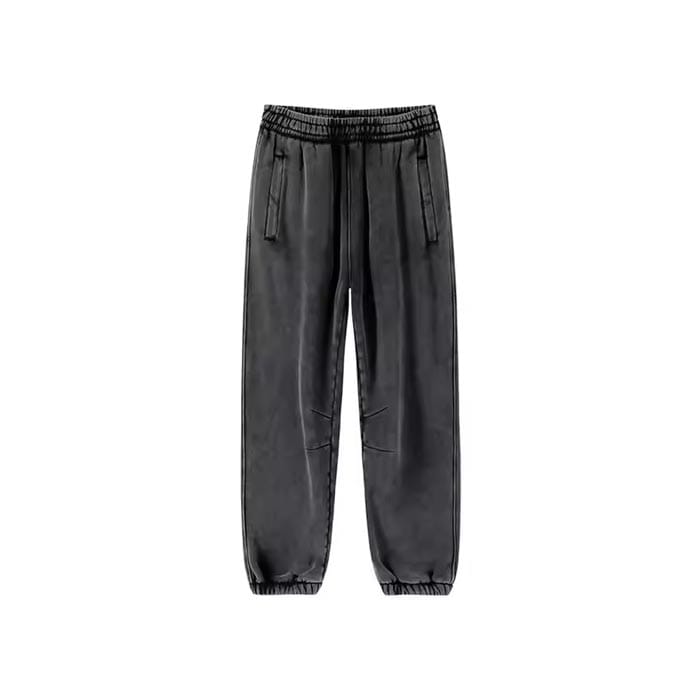 Distressed acid wash sweatpants featuring raw hem and vintage faded detailing