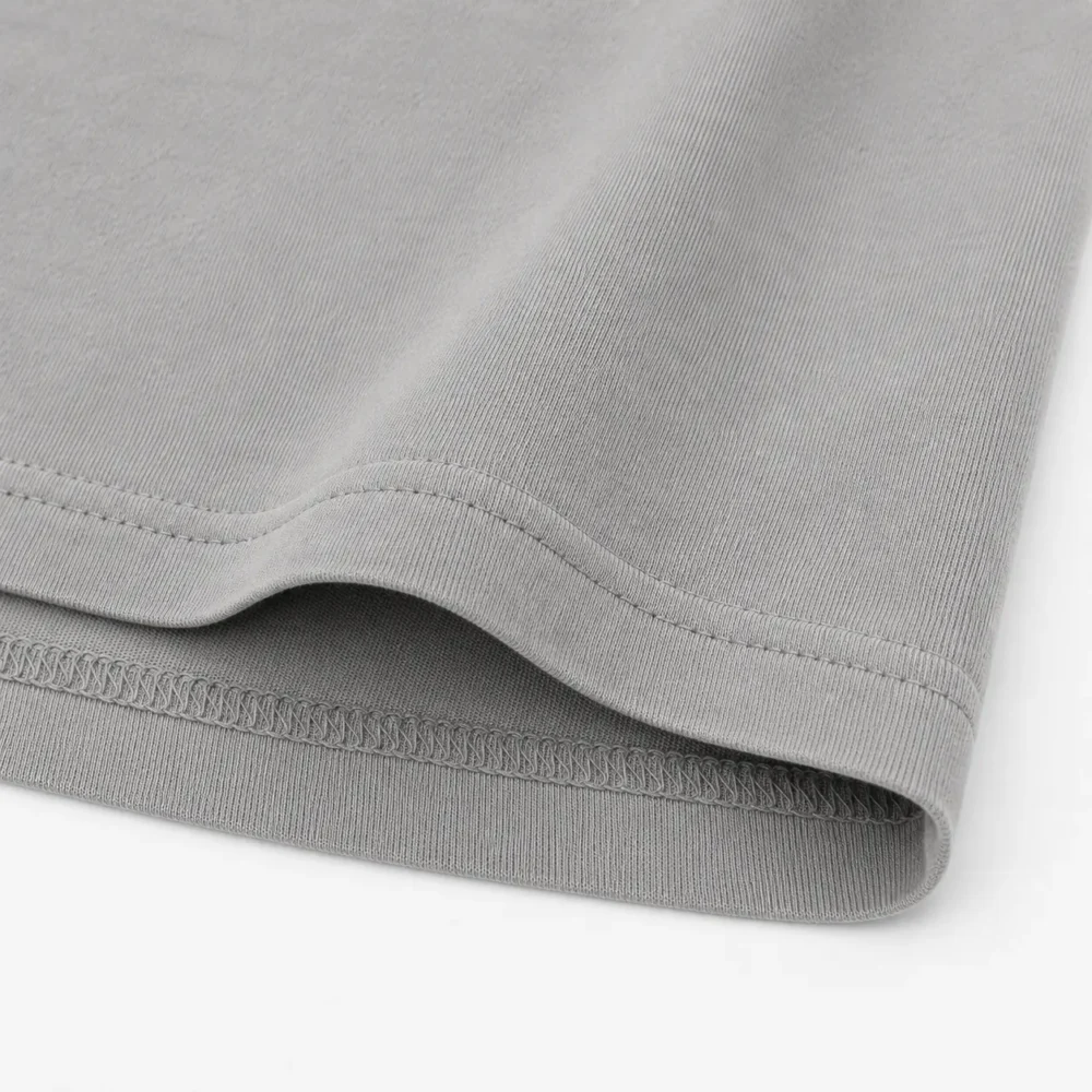 Closeup Hem Finish of Grey Oversized Heavyweight Cotton Boxy Fit T Shirt