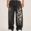 screen-printed-denim-jeans-front Screen printed denim jeans front view with graphic leg print