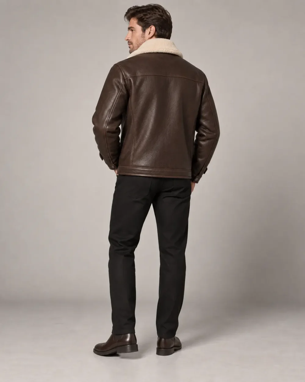 Brown leather jacket with cream shearling collar back view