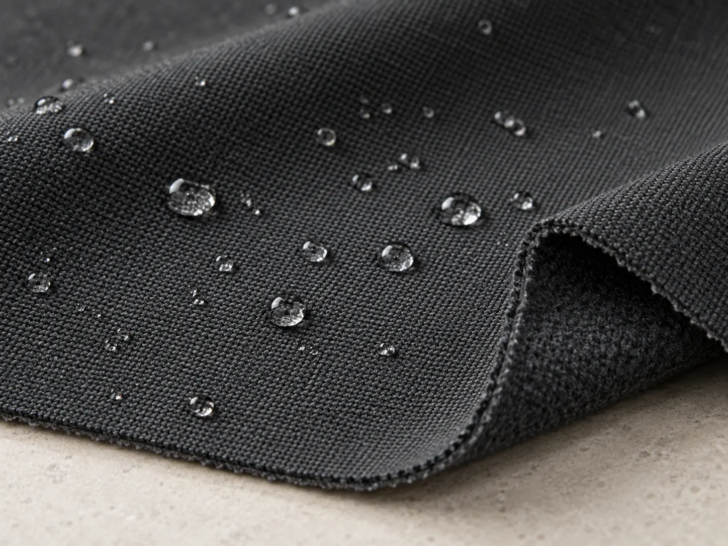 Water beading on custom softshell jacket fabric with water repellent finish